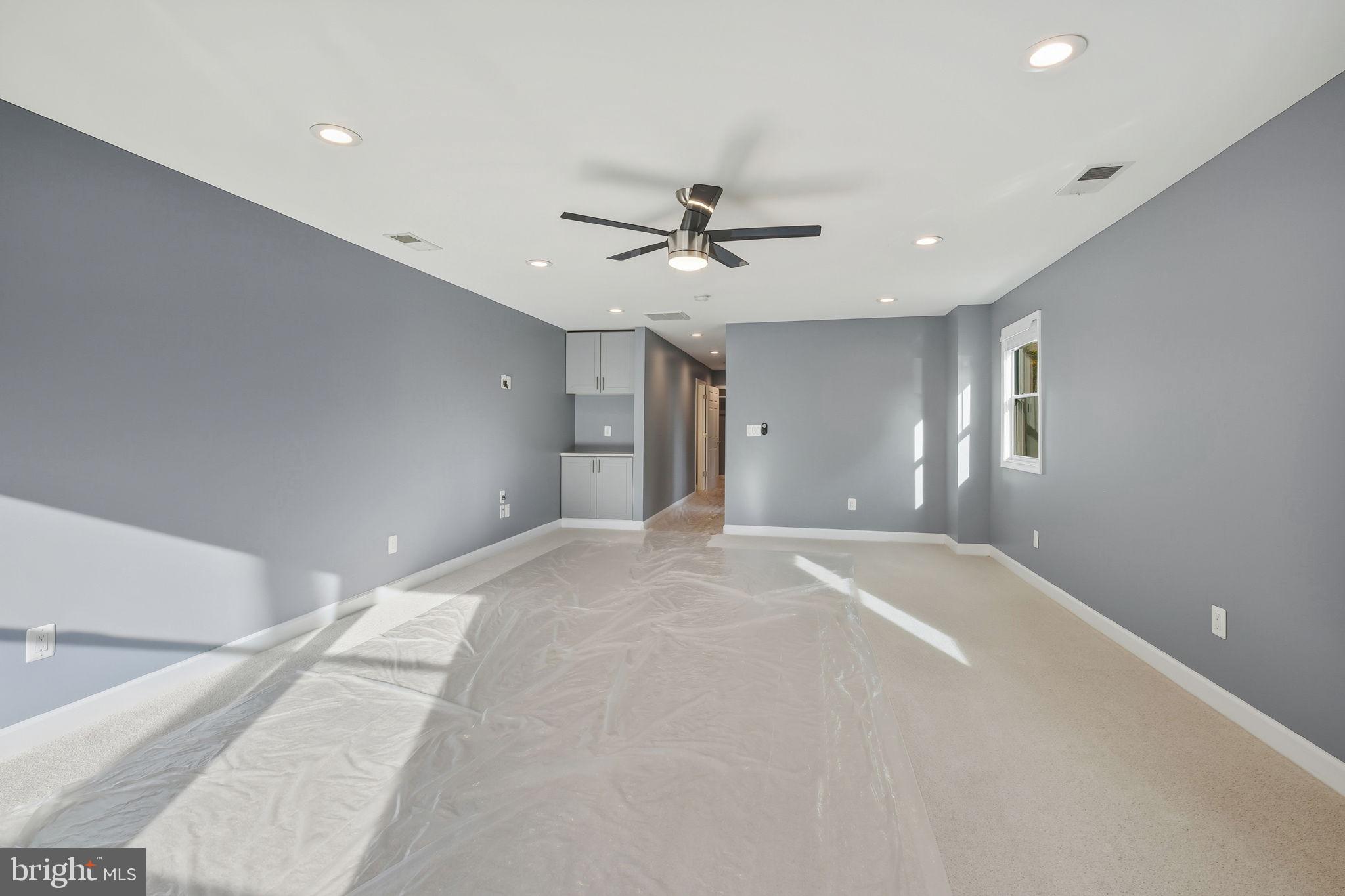 8817 Lagrange Street Lorton, VA 22079 - Photo 24 of 47 a view of a livingroom with a ceiling fan and window