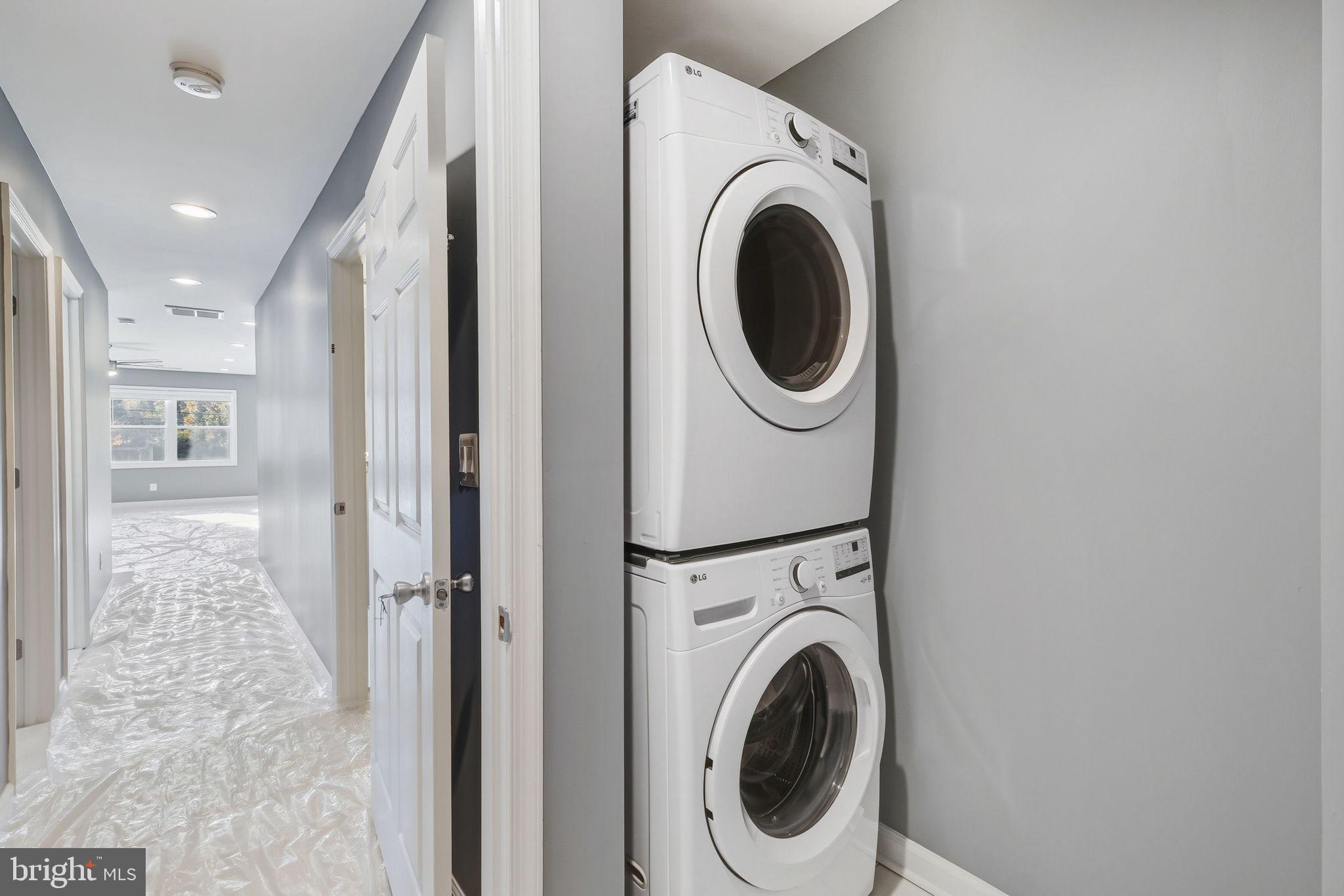 8817 Lagrange Street Lorton, VA 22079 - Photo 28 of 47 a view of a hallway with washer and dryer