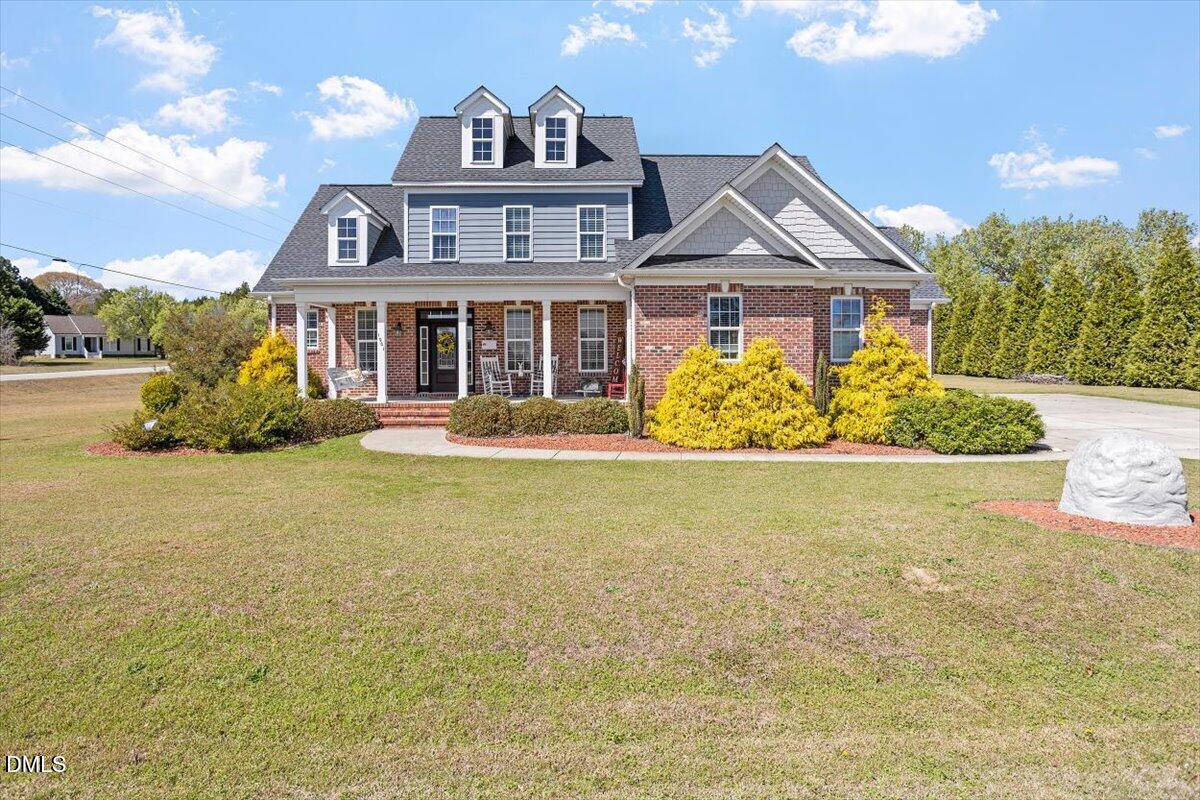 1001 Bellewood Farms Road Raleigh, NC 27603 - Photo 1 of 39 a front view of a house with garden