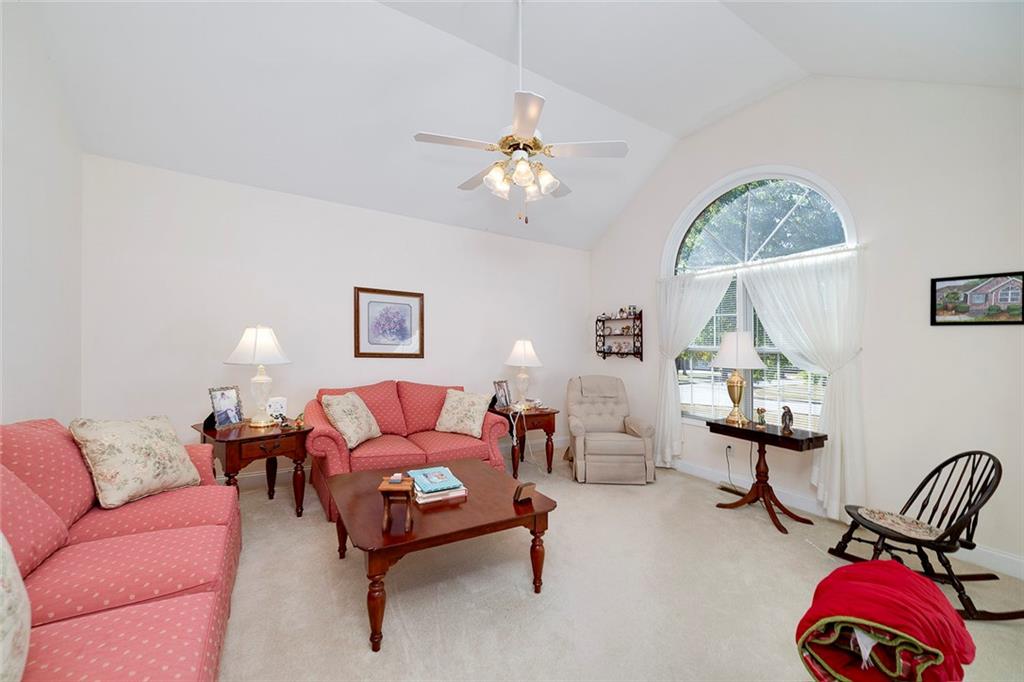 151 Courts Of Hampton Hampton, GA 30228 - Photo 14 of 54 a living room with furniture and a lamp