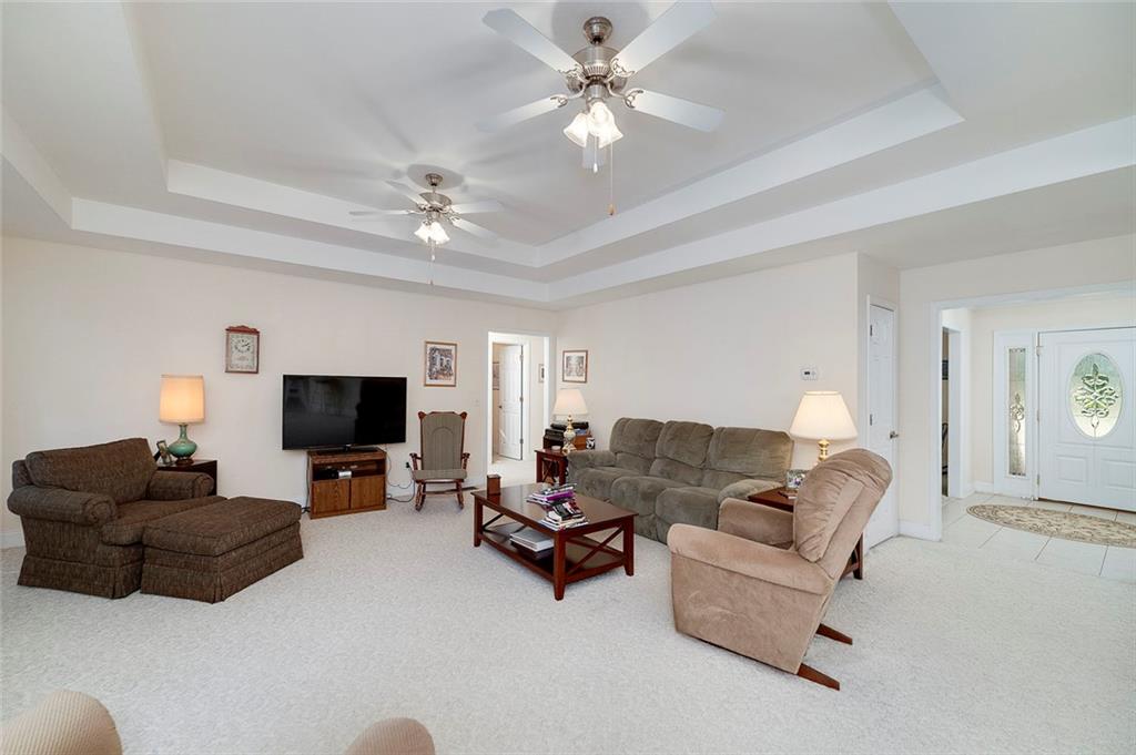 151 Courts Of Hampton Hampton, GA 30228 - Photo 16 of 54 a living room with furniture and a flat screen tv