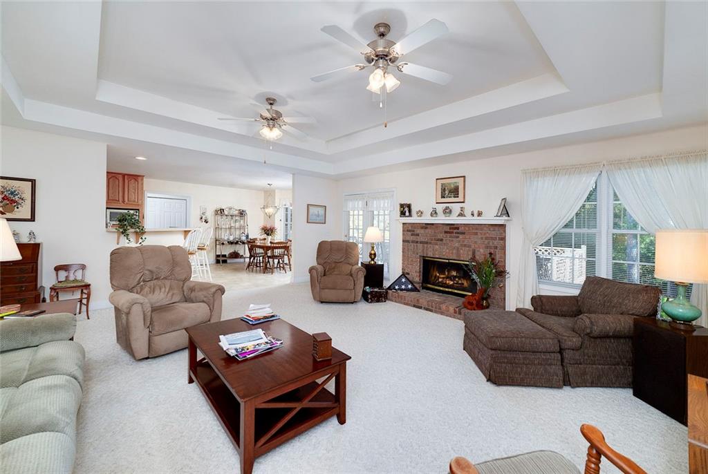 151 Courts Of Hampton Hampton, GA 30228 - Photo 17 of 54 a living room with furniture fireplace and a window