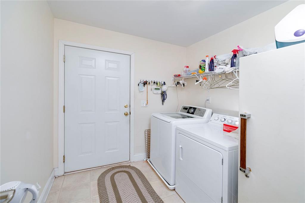 151 Courts Of Hampton Hampton, GA 30228 - Photo 34 of 54 a utility room with dryer and washer