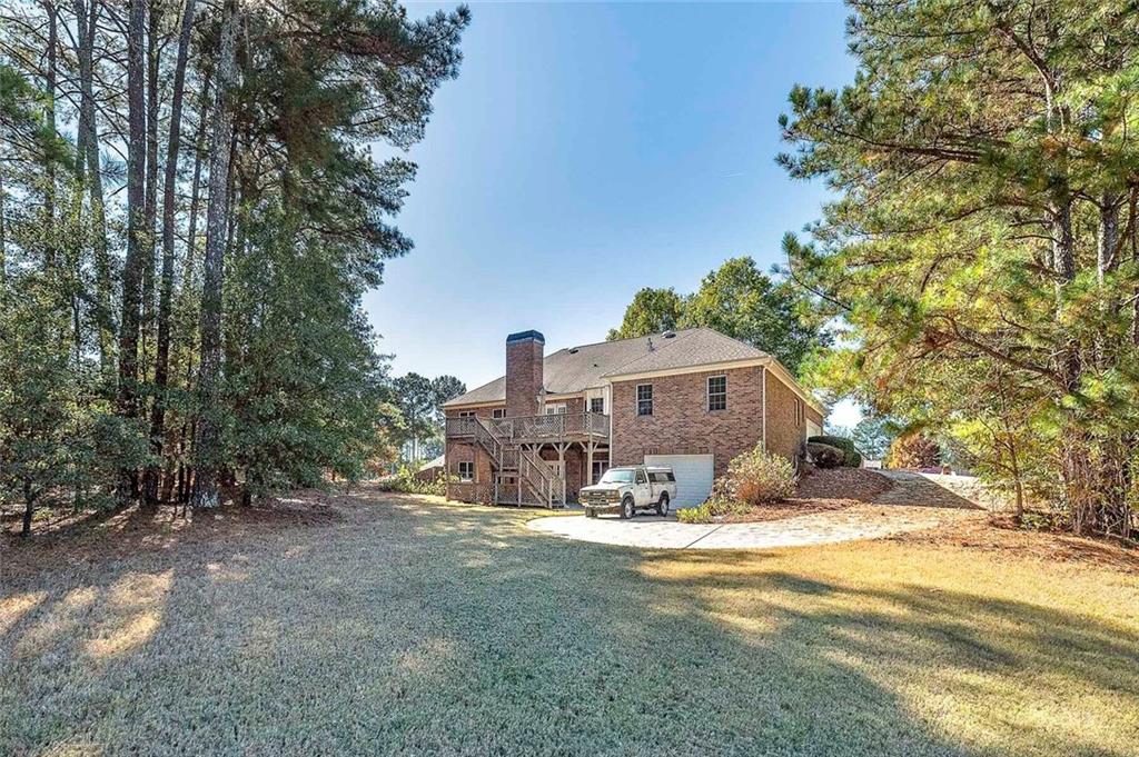 151 Courts Of Hampton Hampton, GA 30228 - Photo 4 of 54 a view of a house with a yard
