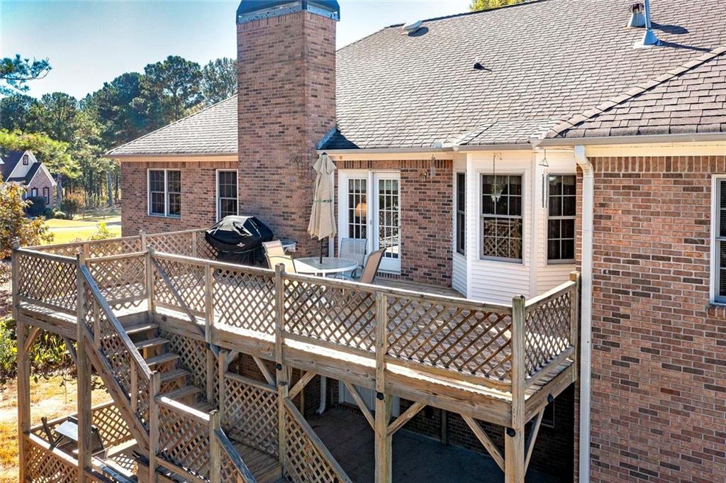 151 Courts Of Hampton Hampton, GA 30228 - Photo 47 of 54 a view of a roof deck with chair and wooden floor