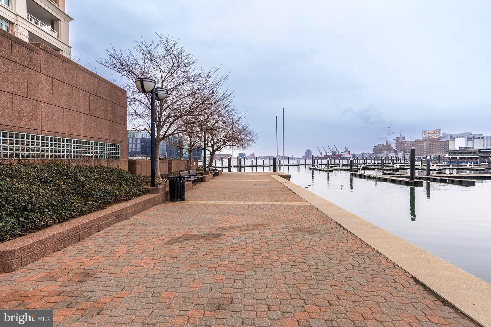100 Harborview Drive, Unit 1106 Baltimore, MD 21230 - Photo 4 of 55 Walkway along building and harbor
