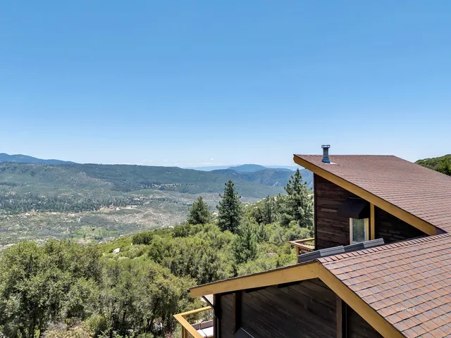 a backyard of a house with lots of green space