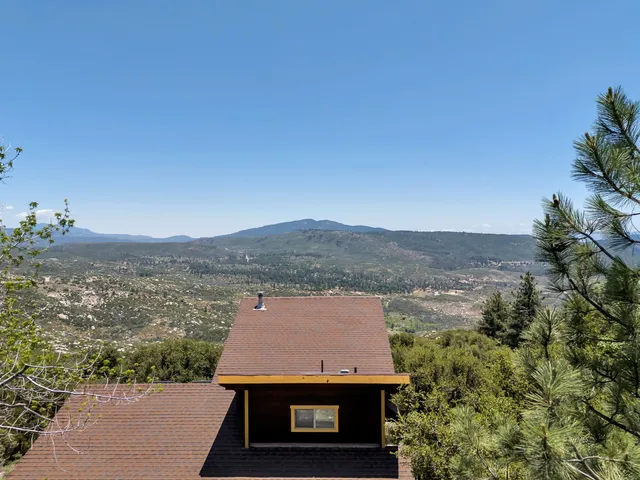 a view of outdoor space with wooden deck and furniture