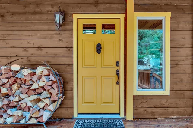 a view of front door with outdoor seating
