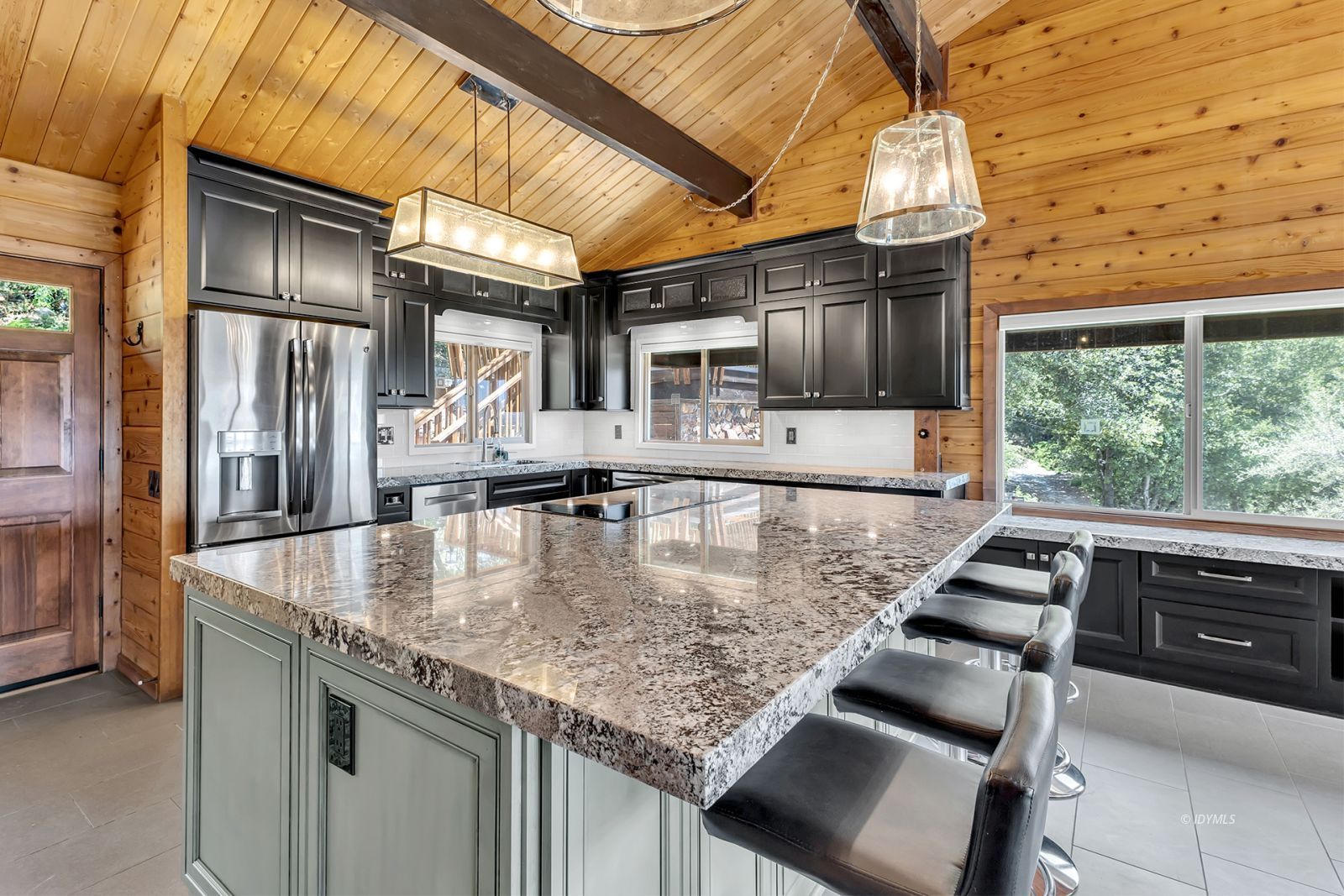 53015 Double View Drive Idyllwild, CA 92549 - Photo 32 of 99 a kitchen with kitchen island a counter space a sink and appliances