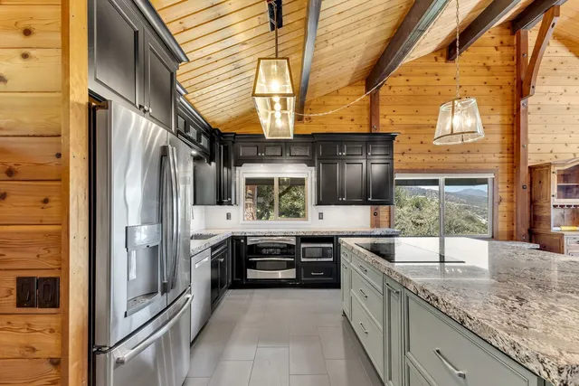 a bathroom with a granite countertop sink mirror bathtub and shower