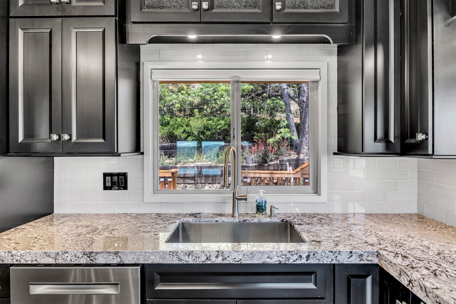 53015 Double View Drive Idyllwild, CA 92549 - Photo 35 of 99 a kitchen with granite countertop a sink and cabinets