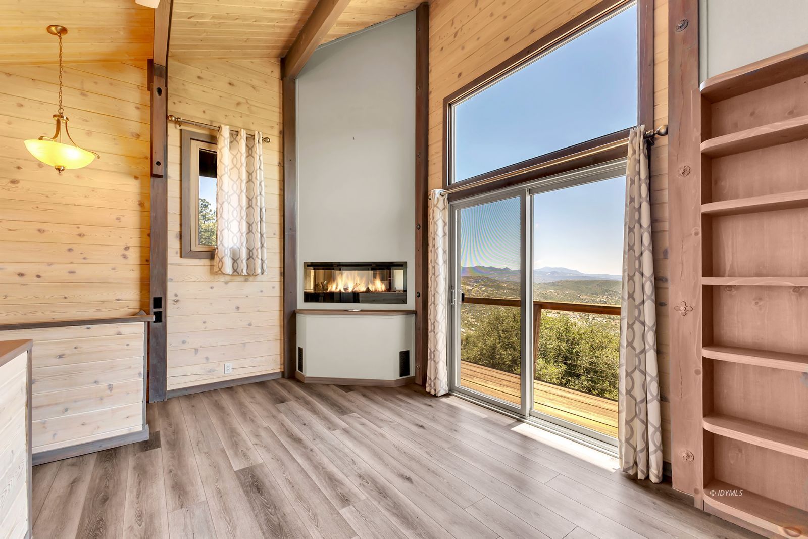 53015 Double View Drive Idyllwild, CA 92549 - Photo 55 of 99 a view of a hallway with wooden floor and windows