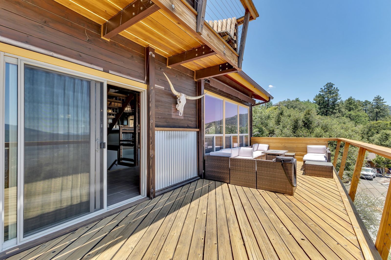 53015 Double View Drive Idyllwild, CA 92549 - Photo 66 of 99 a view of balcony with chairs and wooden floor