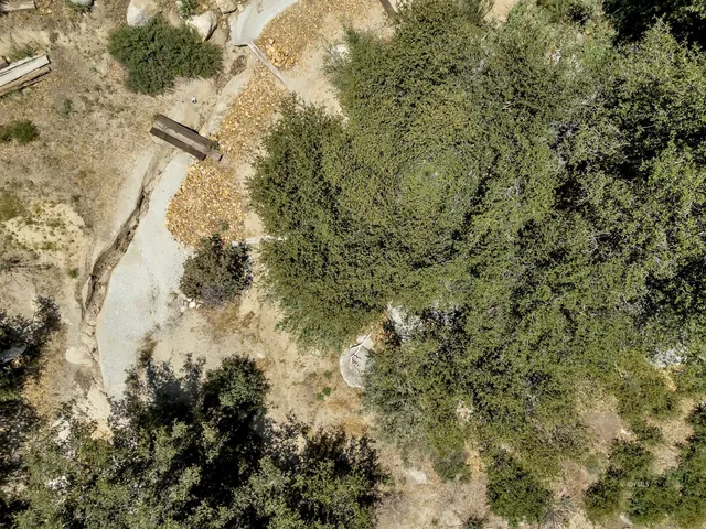 an aerial view of a house with garden