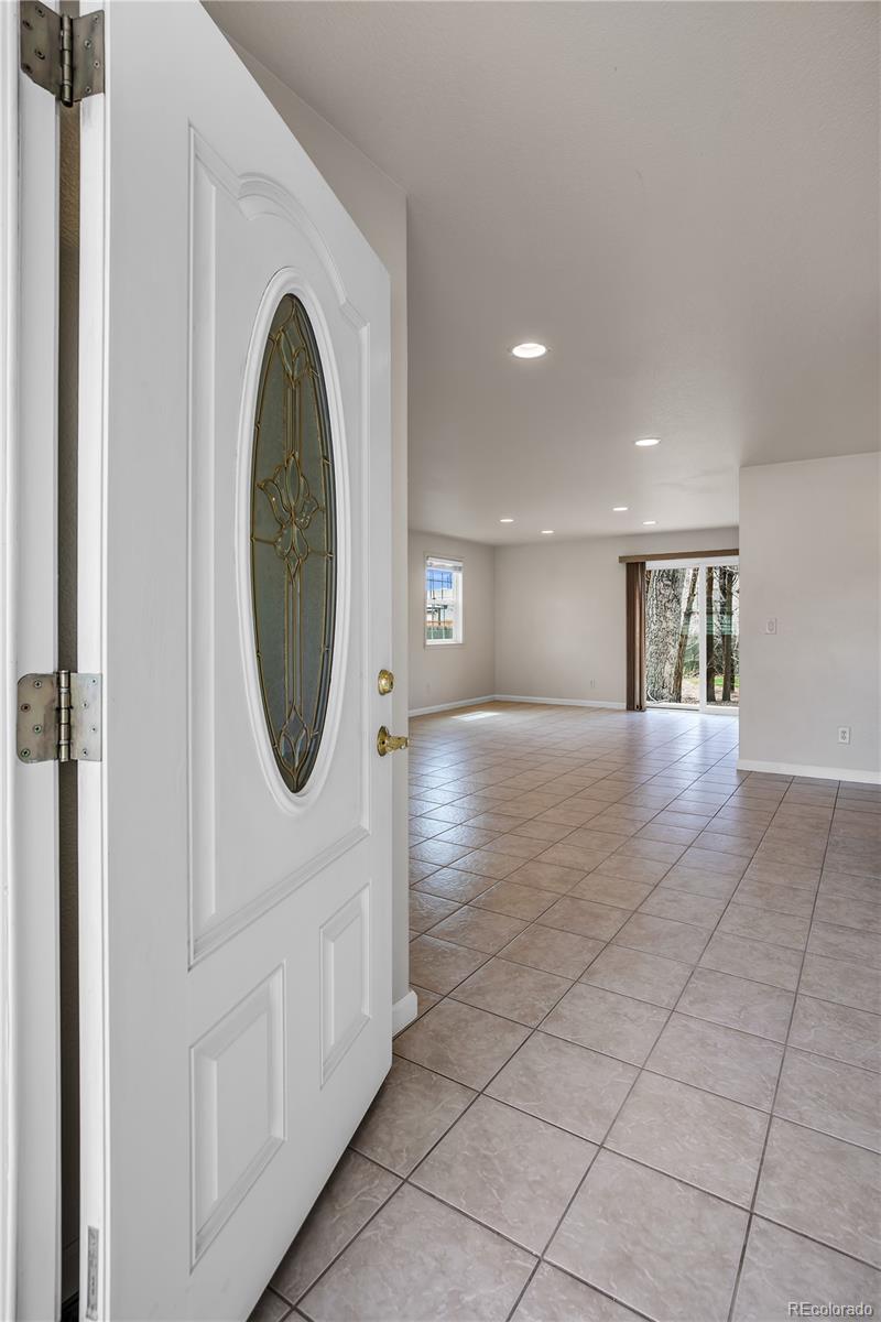 4505 Simms Court Wheat Ridge, CO 80033 - Photo 11 of 37 a view of a hallway with washer and dryer