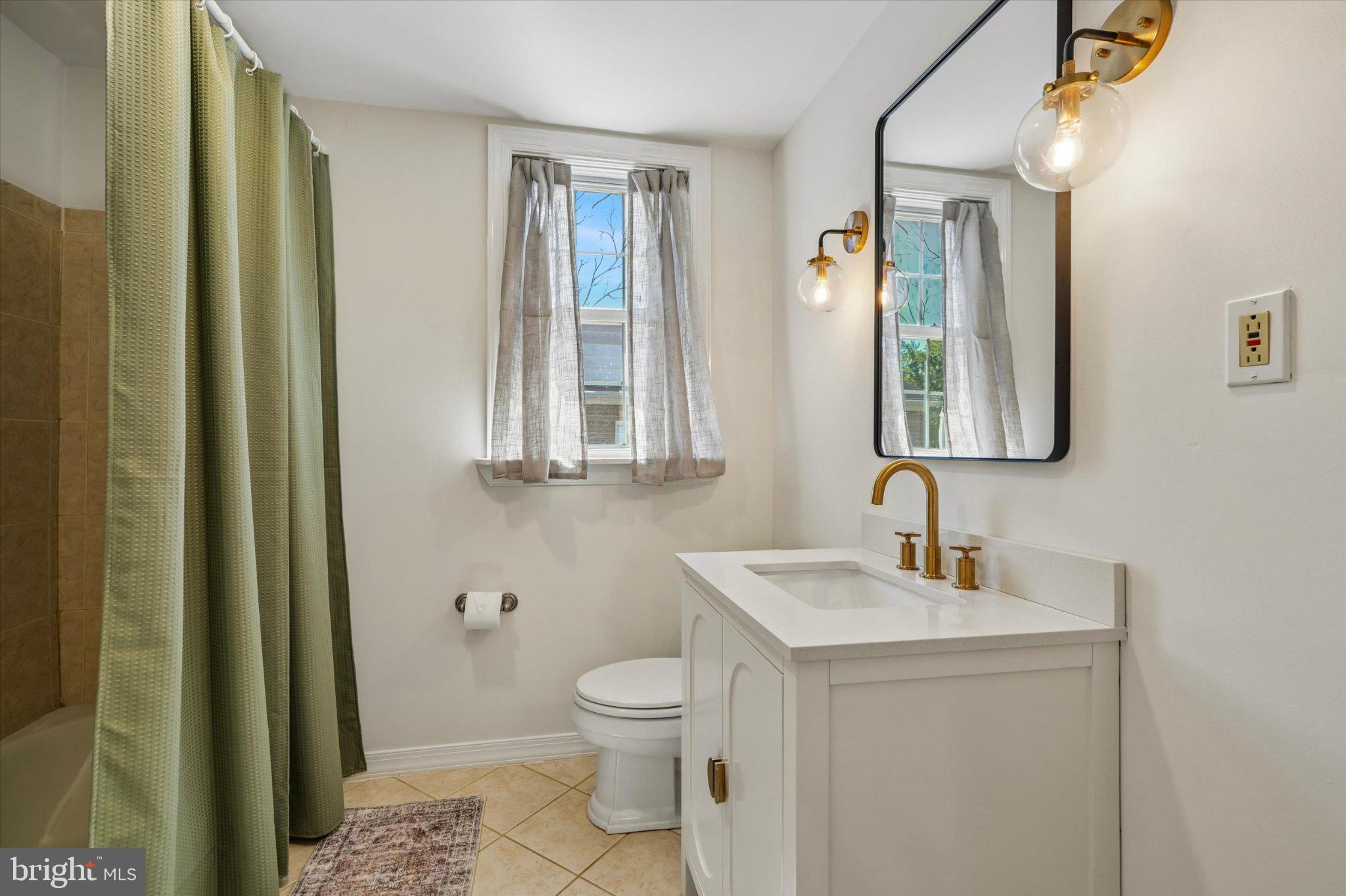 941 Church Road Springfield, PA 19064 - Photo 25 of 39 Renovated hall bathroom with tub and a new vanity.