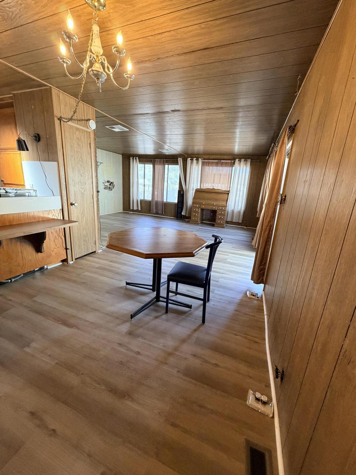 1449 Menomenee Lane, Unit 252 Redding, CA 96003 - Photo 9 of 18 a view of a room with furniture and a window