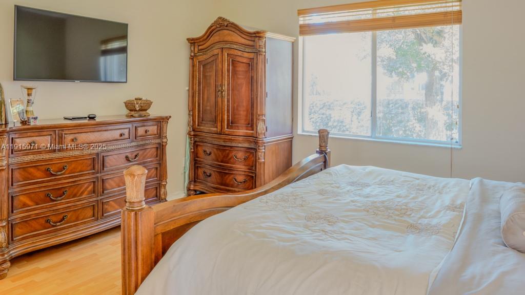 1701 Southeast 17th Avenue Homestead, FL 33035 - Photo 13 of 25 a bed sitting in a bedroom next to a window