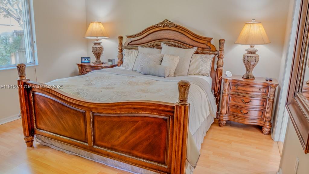 1701 Southeast 17th Avenue Homestead, FL 33035 - Photo 14 of 25 a bedroom with a bed and a dresser