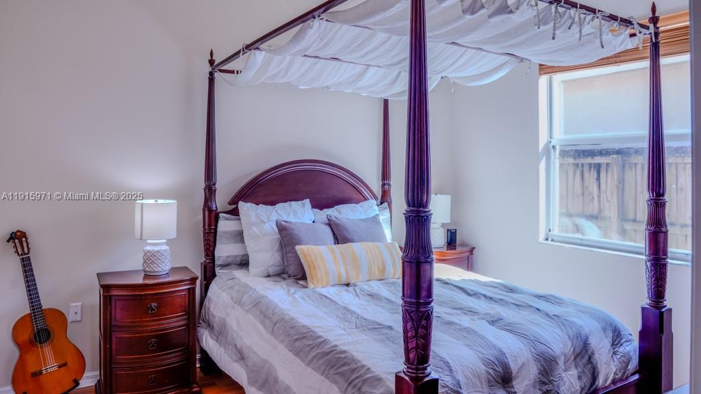 1701 Southeast 17th Avenue Homestead, FL 33035 - Photo 18 of 25 a bed room with a bed and a window