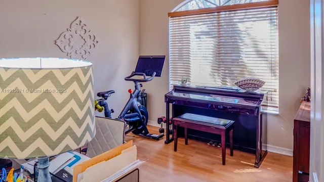 a view of a room with furniture and wooden floor
