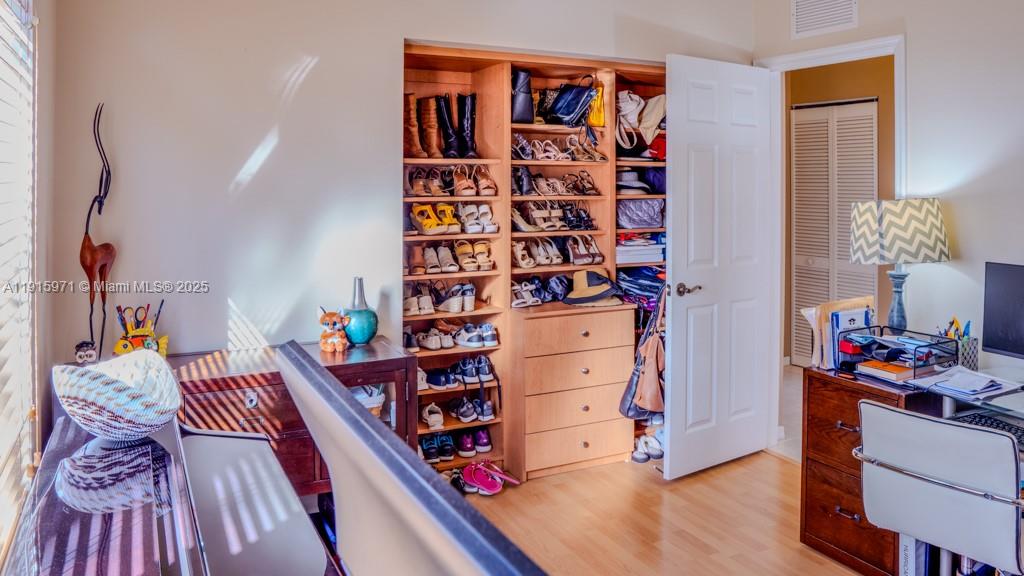 1701 Southeast 17th Avenue Homestead, FL 33035 - Photo 21 of 25 a reading room with furniture and wooden floor
