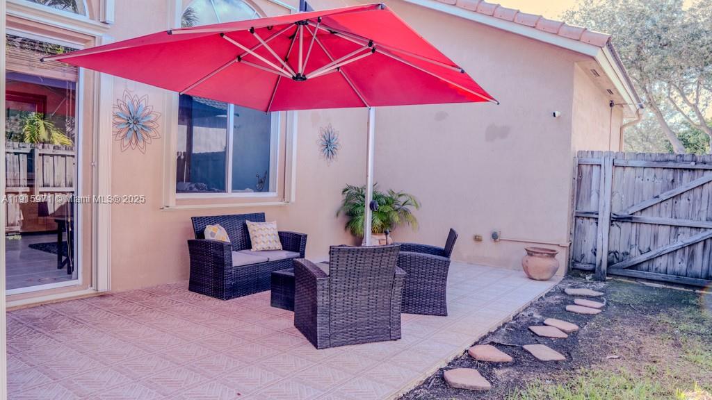 1701 Southeast 17th Avenue Homestead, FL 33035 - Photo 23 of 25 a view of a house with a yard and sitting area