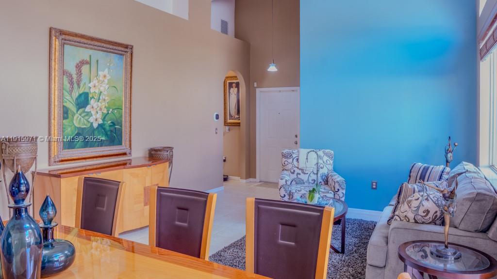1701 Southeast 17th Avenue Homestead, FL 33035 - Photo 5 of 25 a living room with furniture and a window