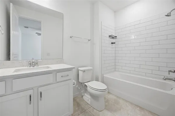 a spacious bathroom with double sink a mirror and a shower