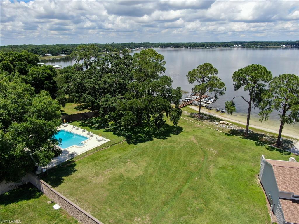 11001 Southeast Sunset Harbor Road, Unit 34 Summerfield, FL 34491 - Photo 26 of 31 Birds eye view of property with a water view