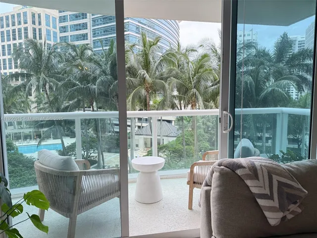 a view of a porch with furniture and garden