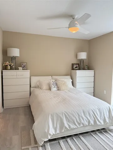 a bedroom with a bed and a lamp