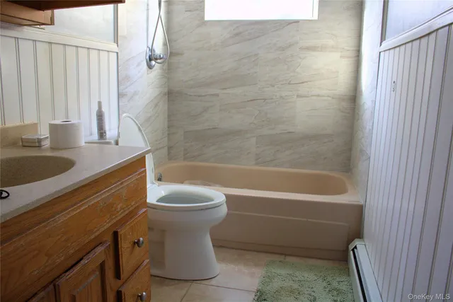 a bathroom with a sink a toilet and a bathtub