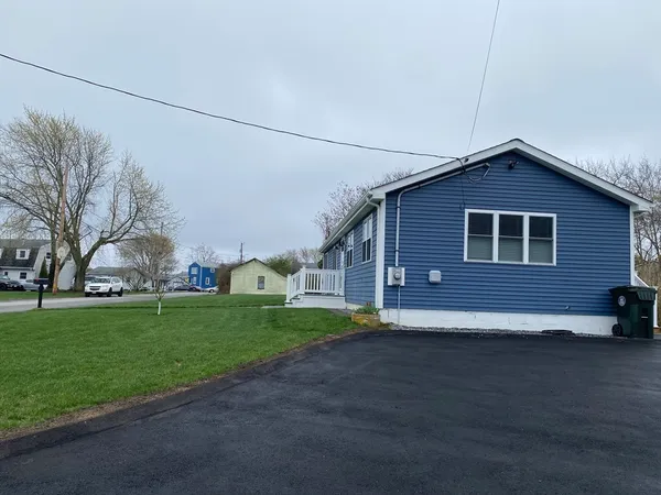 a front view of a house with a yard