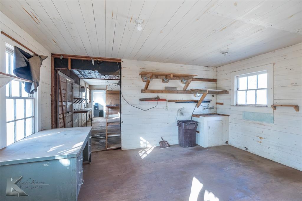 405 South Hinton Street Benjamin, TX 79505 - Photo 32 of 40 Misc room featuring wooden walls