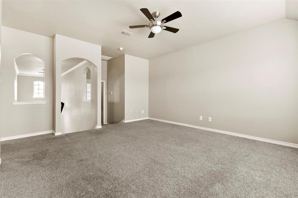 6522 Portside Ridge Lane Dallas, TX 75249 - Photo 19 of 37 Spacious room featuring neutral carpeting and wall tones