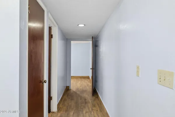 a room with a refrigerator and a stove top oven