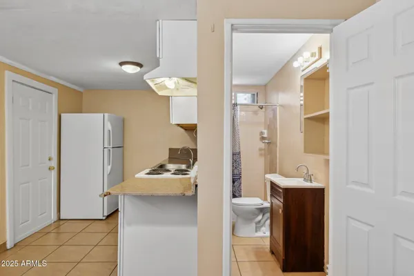 a kitchen with a sink and cabinets