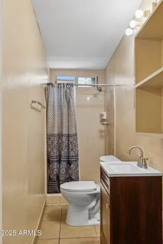 a view of a livingroom with furniture and mirror