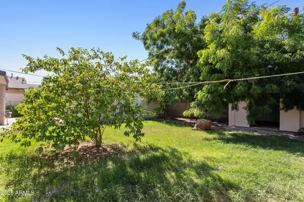 a backyard of a house with lots of green space