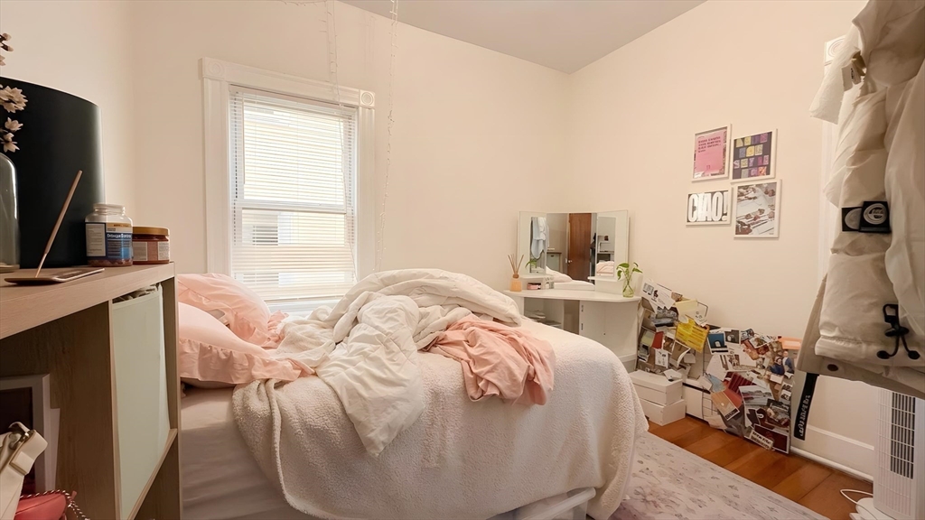 26 Darling Street, Unit 2 Boston, MA 02120 - Photo 8 of 15 a living room with furniture a flat screen tv and a window