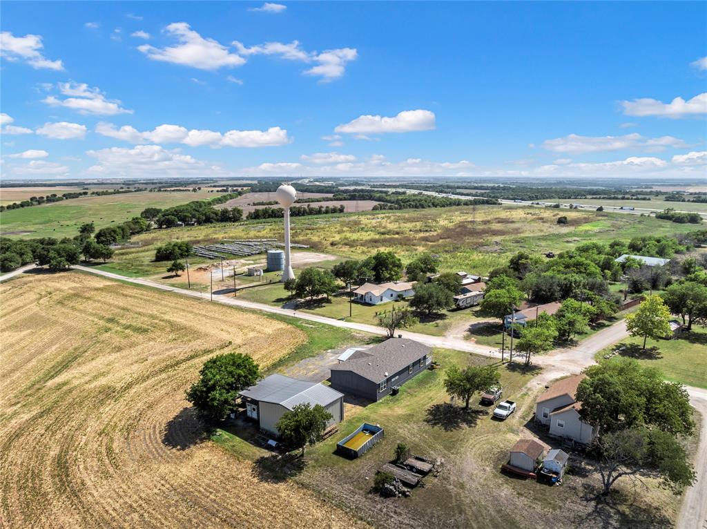 602 3rd Street Abbott, TX 76621 - Photo 36 of 40 Aerial perspective showcasing expansive rural landscape with agricultural fields and scattered residential properties