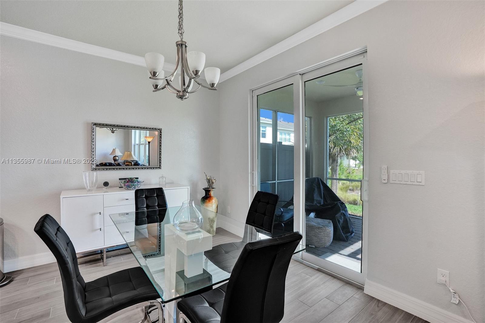 5055 Eucalyptus Drive Hollywood, FL 33021 - Photo 11 of 50 a view of a dining room with furniture window and wooden floor