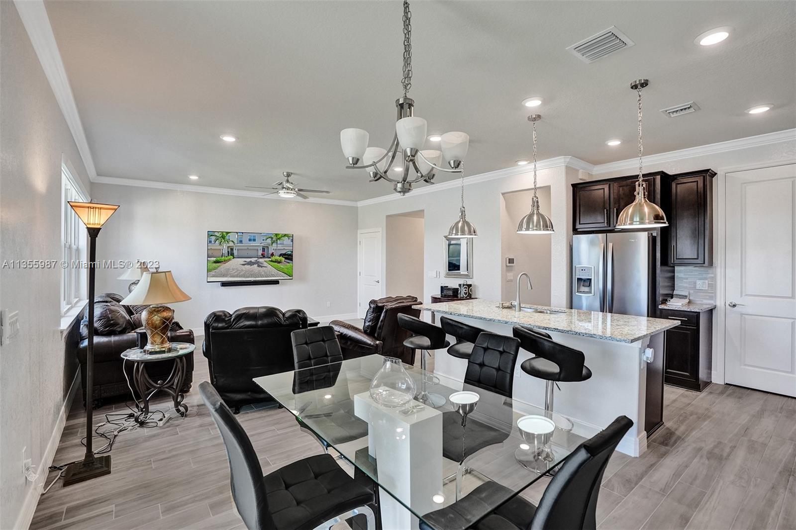 5055 Eucalyptus Drive Hollywood, FL 33021 - Photo 13 of 50 a view of a dining room with furniture