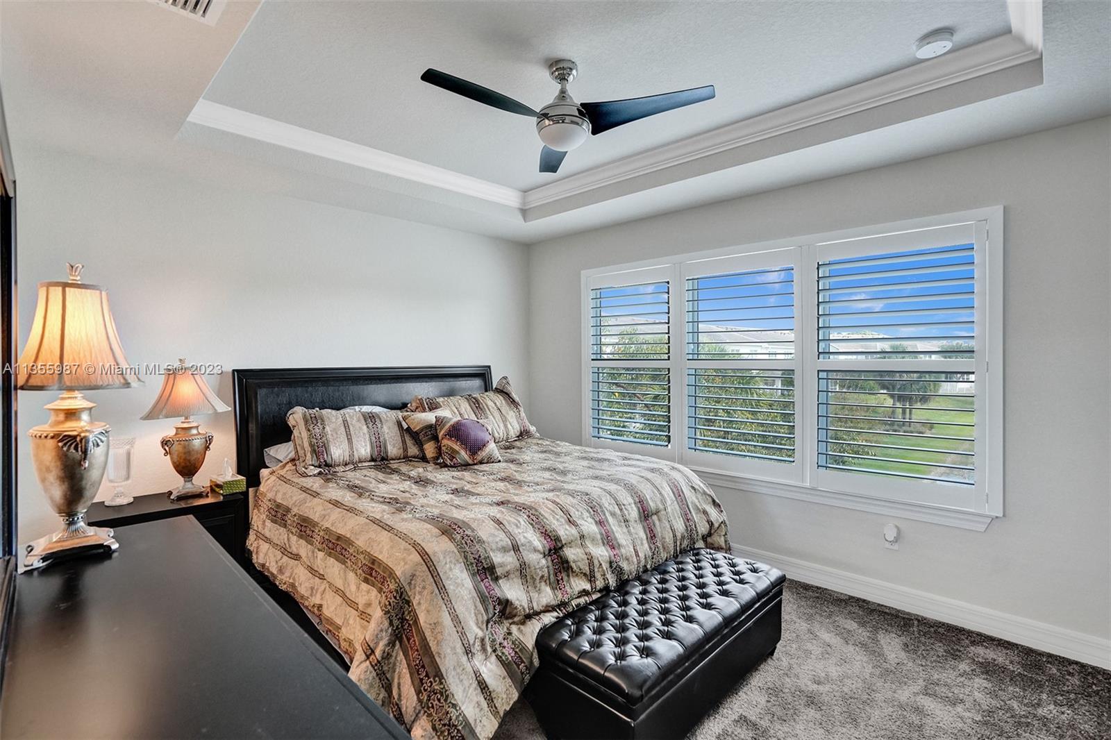 5055 Eucalyptus Drive Hollywood, FL 33021 - Photo 18 of 50 a bedroom with a bed and a large window