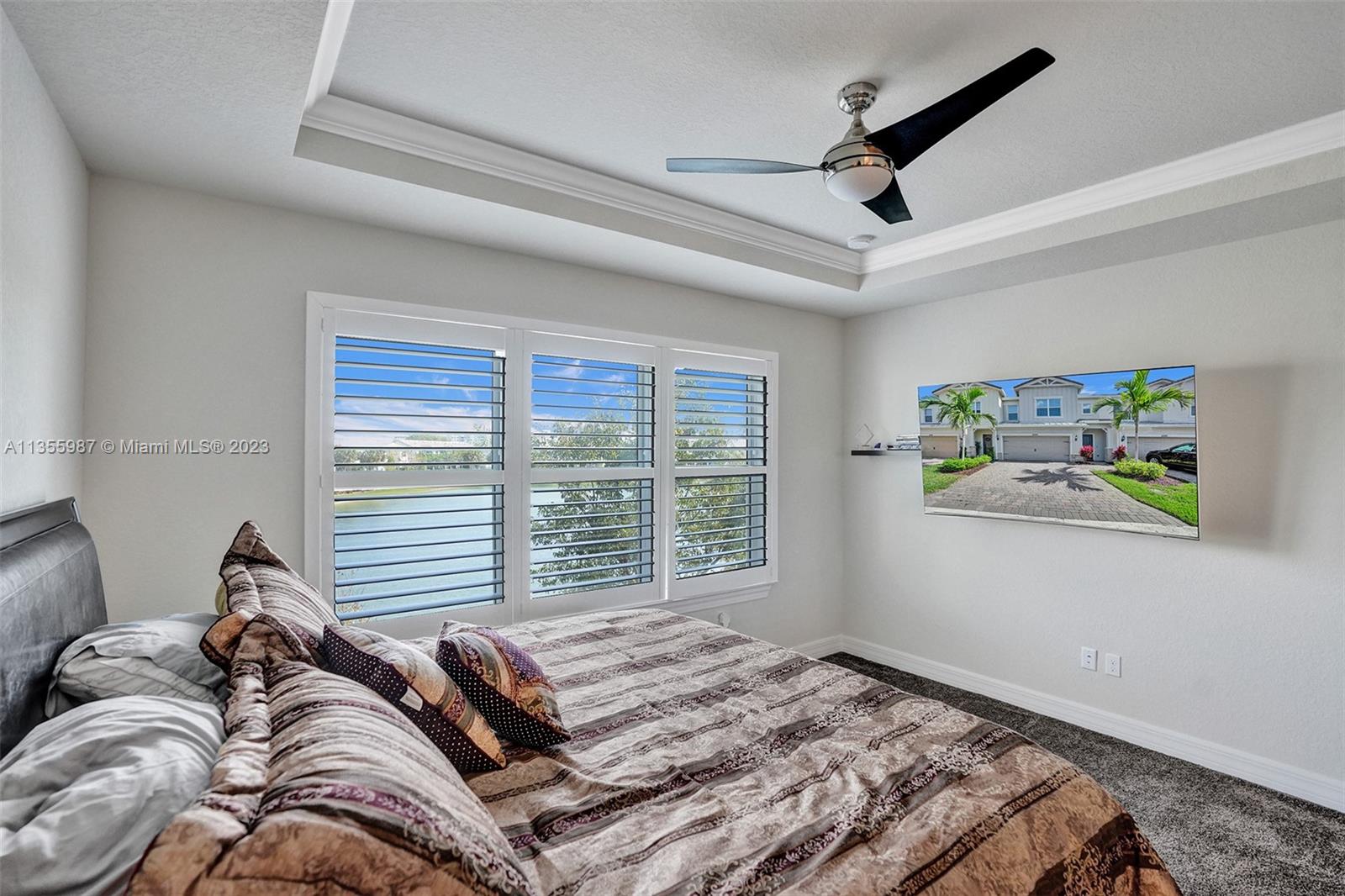 5055 Eucalyptus Drive Hollywood, FL 33021 - Photo 19 of 50 a bed sitting in a bedroom next to a window