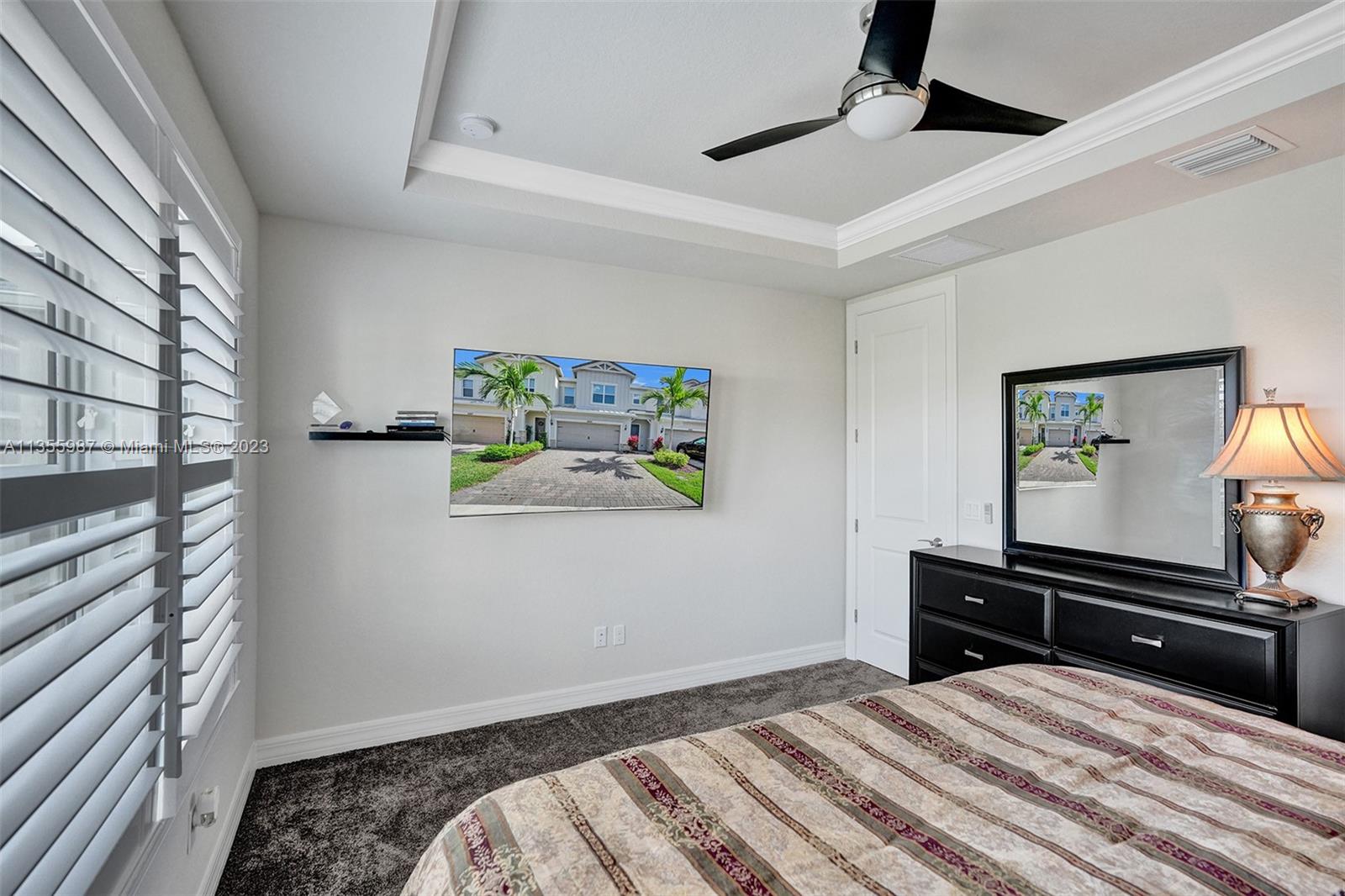 5055 Eucalyptus Drive Hollywood, FL 33021 - Photo 20 of 50 a bedroom with a bed and a flat screen tv