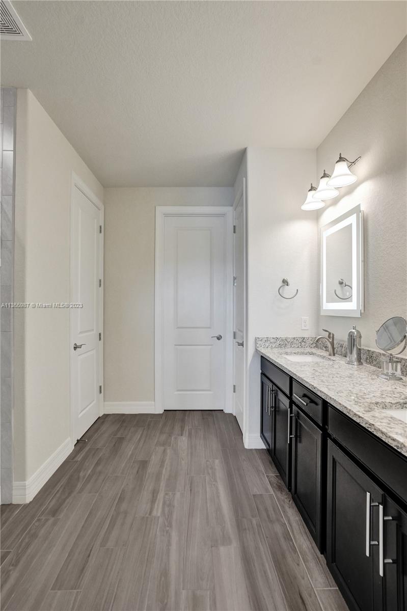 5055 Eucalyptus Drive Hollywood, FL 33021 - Photo 23 of 50 a view of room with wooden floor and electronic appliances