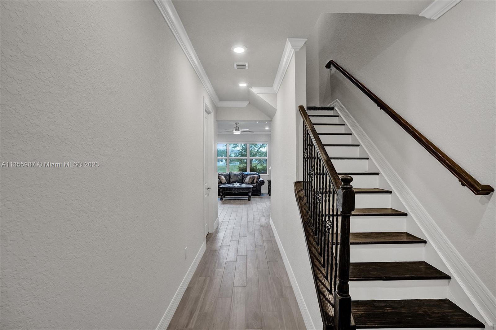 5055 Eucalyptus Drive Hollywood, FL 33021 - Photo 3 of 50 a view of entryway and hall with wooden floor